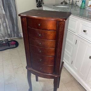 Wood standing jewelry box.